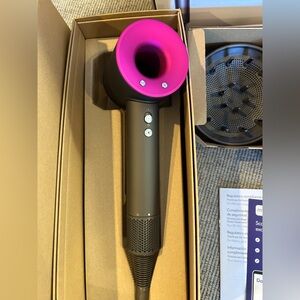 New Dyson Supersonic Hair Dryer with all the attachments.